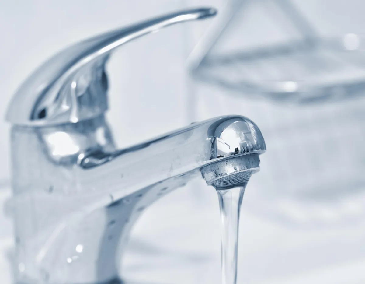 Close up shot of a leaking tap
